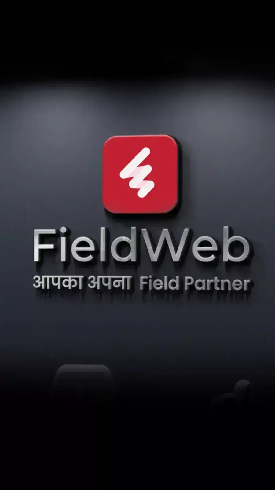 The FieldWeb logo features a red emblem with a white center, in gray wall also includes Hindi words, with a modern aesthetic.