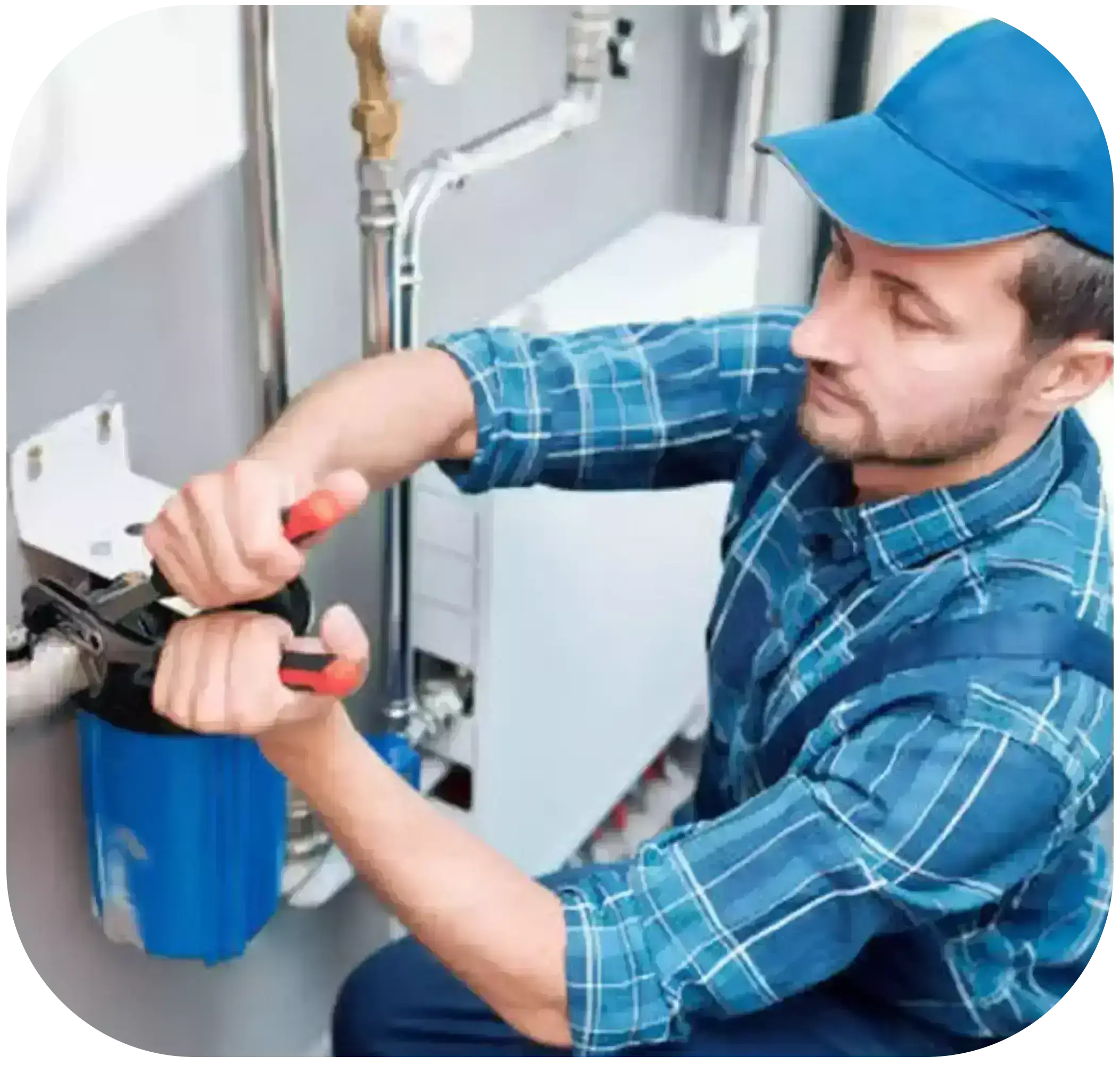 A technician in a blue shirt and pants with a blue cap is repairing a blue RO water purifier using water pipe pliers.
